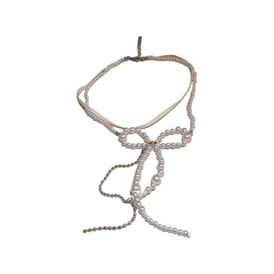 Elegant double-layered pearl bow necklace with long tassel in soft white and silver
