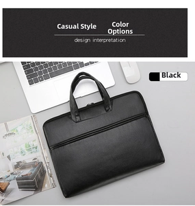 Detailed top view of a black water-resistant laptop bag with smooth leather texture