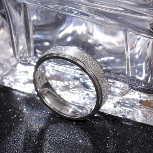 Macro shot of a 6mm titanium steel ring featuring brushed inner and frosted outer surfaces
