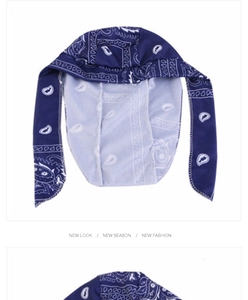 Detailed view of dark blue paisley durag with long ties and breathable silky fabric texture