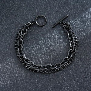 Close-up of black stainless steel Cuban chain bracelet with toggle clasp detail