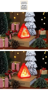 Close-up of red triangular Christmas lanterns with LED lights and festive Santa patterns
