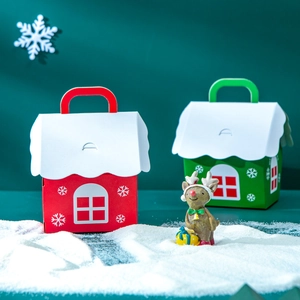 Red and green house-shaped Christmas gift boxes with snowflake patterns for candy