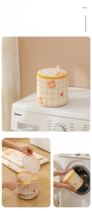 Detail of bear print cylindrical laundry bag with mesh fabric and zipper for delicates