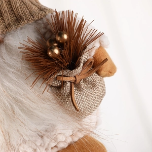 Handcrafted Christmas gnome ornament featuring plush faux fur and knitted fabric details