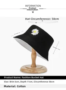 Detail view of cotton bucket hat with white daisy embroidery and size specifications