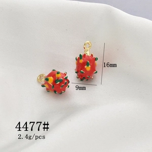 Detail of red pitaya fruit charms in enamel alloy with 16mm height and 9mm width