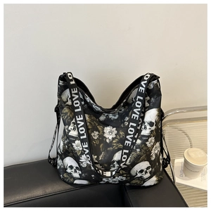 Detail of nylon tote bag with skull and flower print and LOVE lettered shoulder strap