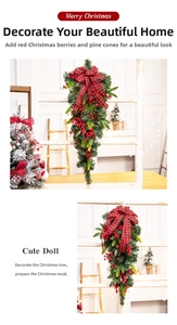 Christmas garland with pine cones, red berries and plaid bow for festive home decor