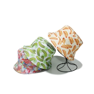 Three summer bucket hats with fun hot dog, cucumber, and candy prints for sun protection