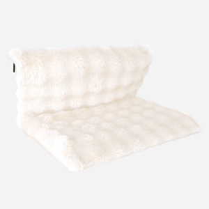 Detail of white long-plush pet bed cushion featuring a metal zipper and soft fur texture