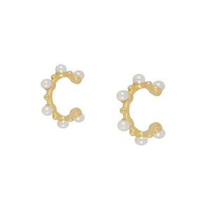 Golden C-shaped hoop earrings with small white pearls on a clean white background