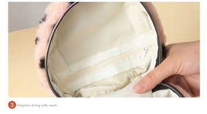 Detail of pink leopard plush makeup bag showing polyester lining and zipper mesh pocket
