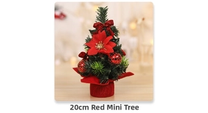 Detail of 20cm mini desktop Christmas tree with red poinsettia flowers and gold bokeh lights