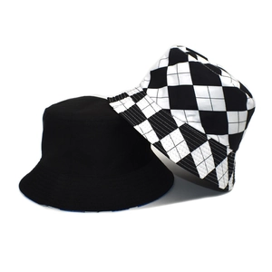 Detail of reversible black bucket hat with classic black and white checkered pattern fabric