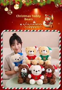 Close-up of assorted plush Christmas teddy bears in various colors with festive hats