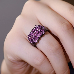 Vintage floral cluster ring with purple gemstones and black plated metal finish