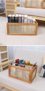Detail of vintage rattan storage basket with wood frame and side handles for home organizing