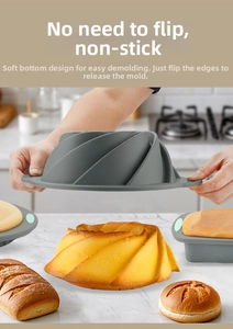 Flexible grey silicone cake mold with spiral pattern showing easy release feature