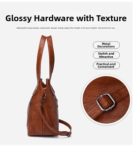 Detail of adjustable shoulder strap and textured brown leather on vintage tote bag