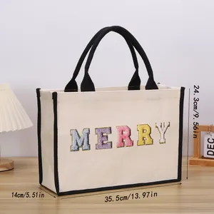 Detail showing dimensions of the canvas tote bag: 35.5cm length, 14cm width, 24.3cm height