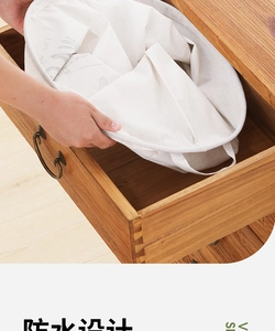 Folded waterproof cotton laundry basket stored inside a wooden drawer for space-saving
