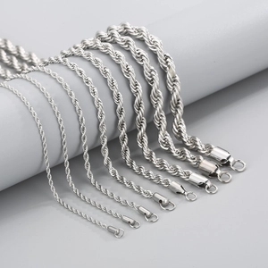 Detail of various thickness silver titanium steel twist chains with metallic luster