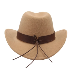 Close-up of khaki western cowboy hat with brown leather strap and intricate cord knot