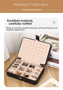 Detail view of black PU leather jewelry box featuring ring slots and earring studs panel