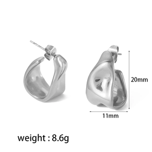 Detail view of irregular geometric silver earrings with precise size and weight measurements