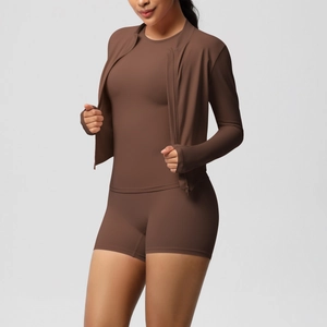 Detailed close-up of dark chocolate yoga set featuring high-stretch moisture-wicking fabric