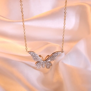 Exquisite gold butterfly pendant necklace with sparkling cubic zirconia on gold silk