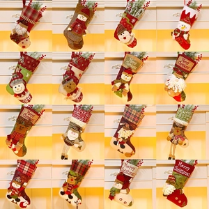 Festive Christmas stockings in 16 styles featuring Santa, snowman, and reindeer designs