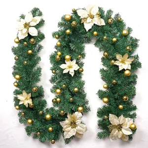Detail of 2.7m Christmas garland with gold baubles and cream flowers on green needles