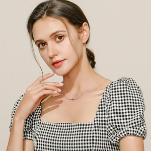 Elegant S925 sterling silver star necklace with turquoise pendant on a female model
