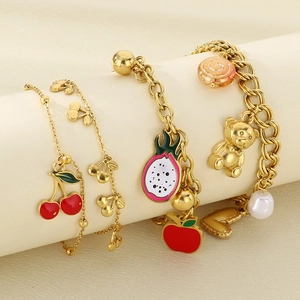 Gold titanium steel fruit bracelet set with cherry, dragon fruit, and pearl charms