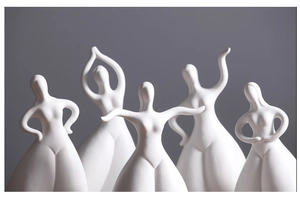 Set of five elegant matte white ceramic female dancer sculptures with artistic curves