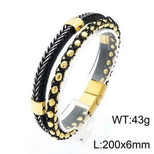 Close-up of mens black braided leather bracelet with gold metal beads and magnetic clasp