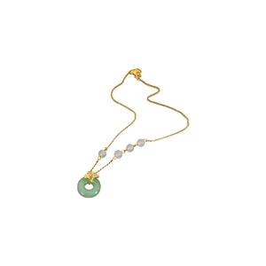 Gold plated ginkgo leaf necklace with green donut jade pendant on white background