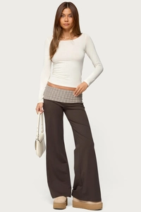Detail showing women's brown wide-leg pants with a striped fold-over waistband design