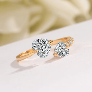Elegant gold open heart ring with sparkling zircons and micro-paved band detail