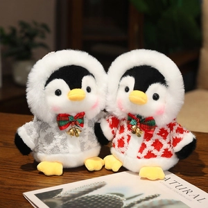 Plush penguin toys with sequin jackets and checkered sweaters in cozy home setting