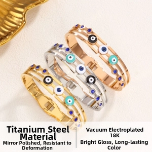 Detail of 18K gold plated stainless steel devil eye bangles with colorful enamel inlay