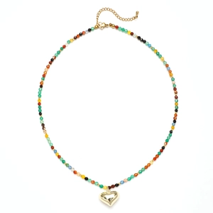 Bohemian natural stone beaded necklace featuring a gold heart pendant and adjustable clasp