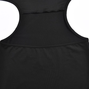 Detailed close-up of black knitted fabric texture and premium stitching on dress