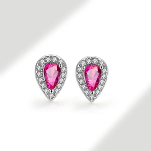 Close-up of pink pear-shaped gemstone earrings with white zircon halo on silver setting