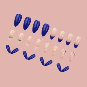 Blue almond press-on nails with French tips, heart designs and rhinestones