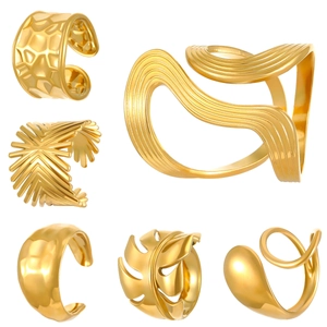 Detail view of 18K gold plated stainless steel rings featuring geometric molten textures