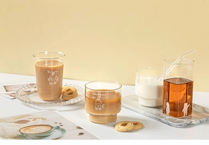 Close-up of cute cartoon glass cups featuring My Puppy and Hello Bear designs