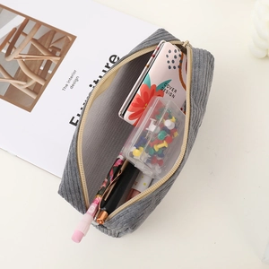 Top view of open dark gray corduroy shark pencil case showing spacious interior storage